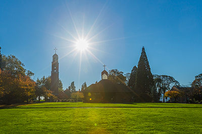 Sun rising over the Chapel of Christ the Teacher and Bell Tower