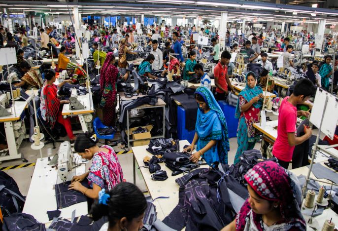 room full of workers in Indian garment factory