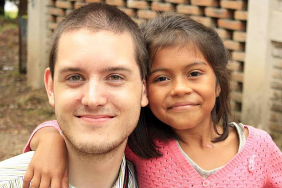 male alumnus with child at NPH Honduras 