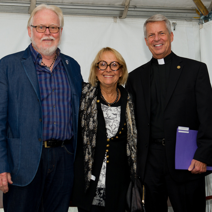 Photo of Jim Berchtold, Amy Dundon-Berchtold and President Rev. Mark L. Poorman, C.S.C.