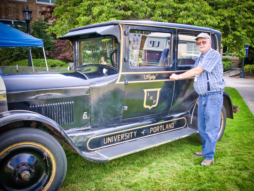 Bill Hoaglan stands next to "Higby" a 1925 FLINT Model H-40 antique car