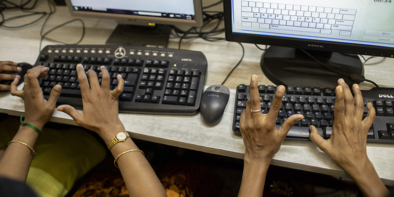photo of hands typing on keyboard