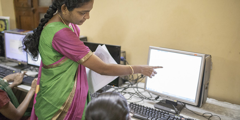 woman teaching computer skills