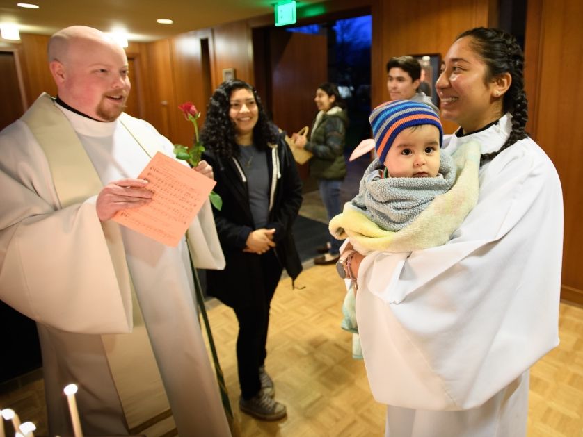 Pastoral workers converse before a religious service. 