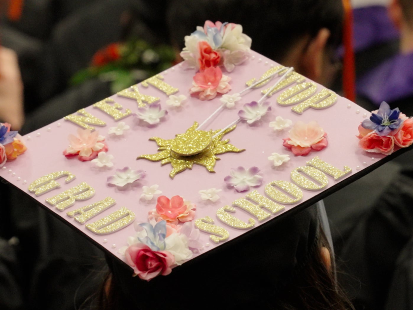 A top view of a student's hand-decorated mortar board at commencement.