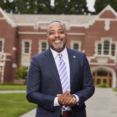 Robert D. Kelly, PhD, standing outside Dundon-Berchtold Hall at UP