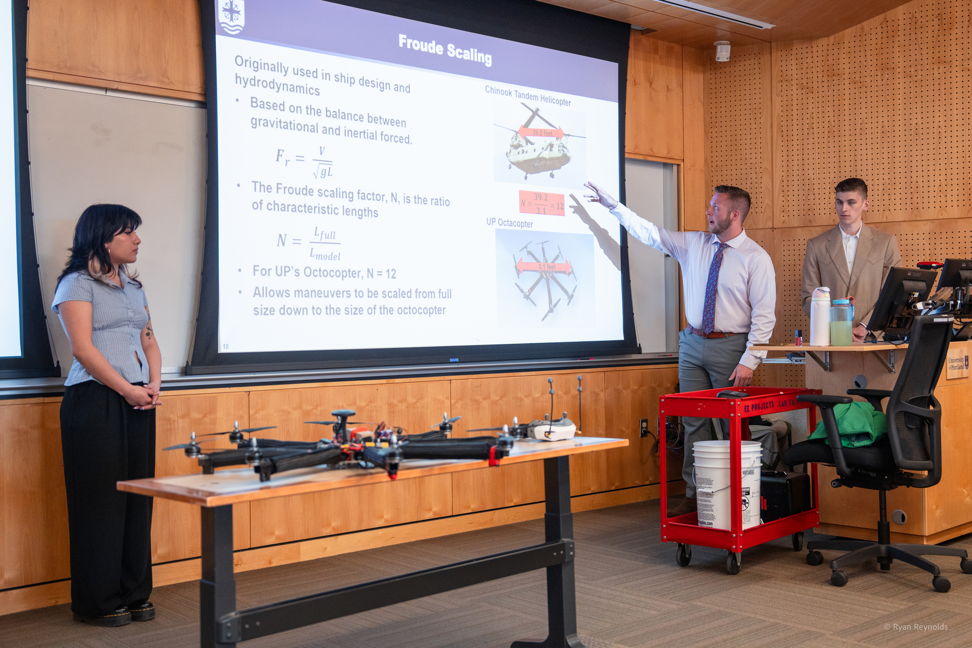 A group of undergaduate enginerering students present their hydrodynamics research during a scholarship day presentation at UP.