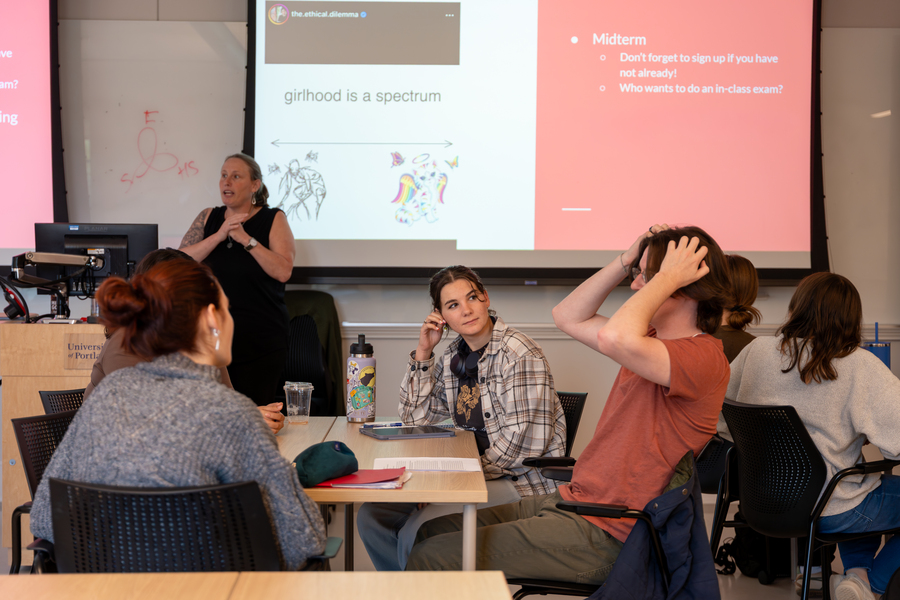 Students engaged in classroom discussion during a gender studies course