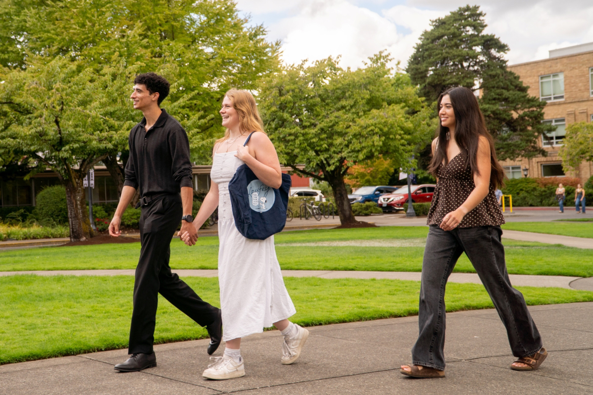 Students walking across the quad on a summer day