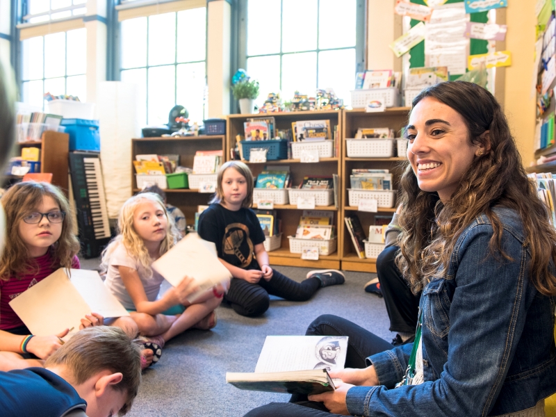 A UP student teacher reads to children at Duniway elementary school.