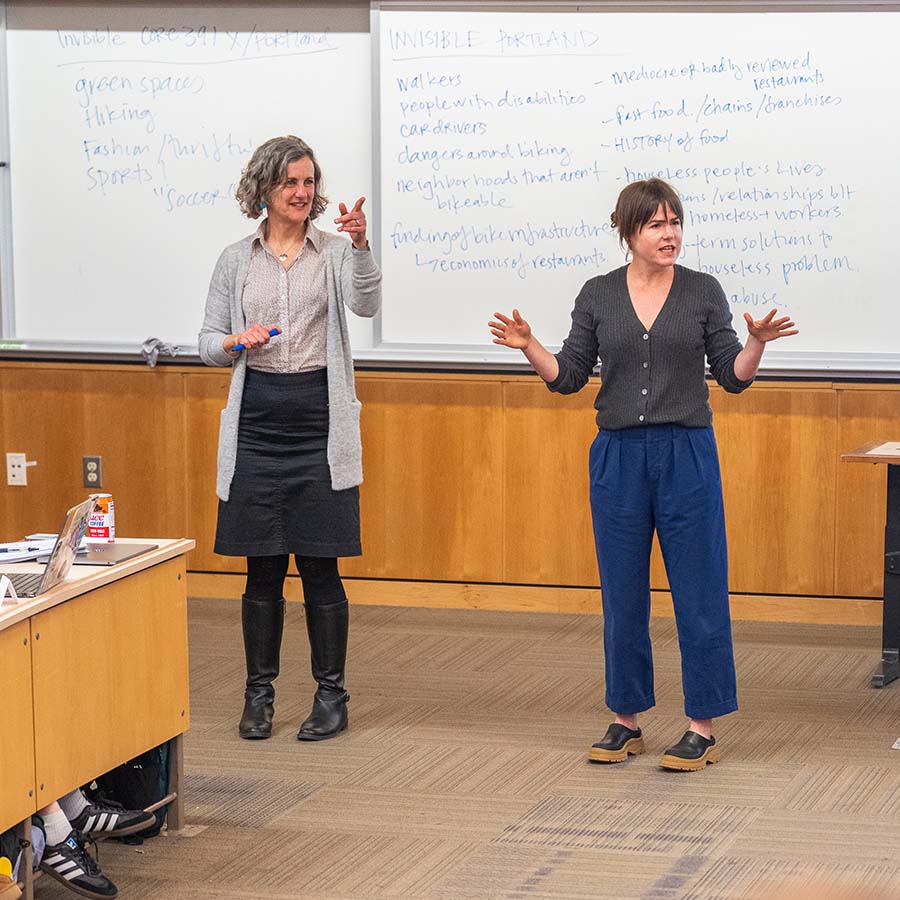A University of Portland professor and a Research Fellow tandem teach a class of students in the College of Arts and Sciences
