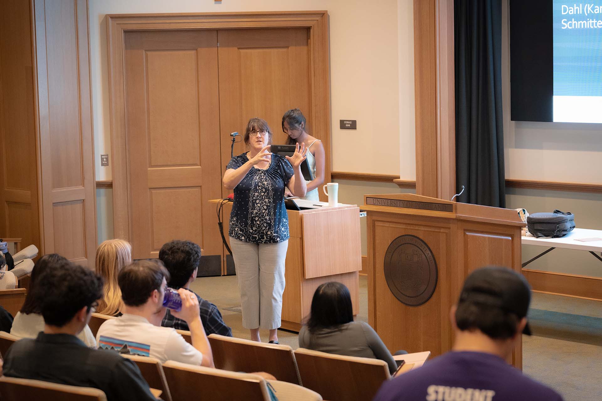 University of Portland professor giving a political science lecture in DB Hall.