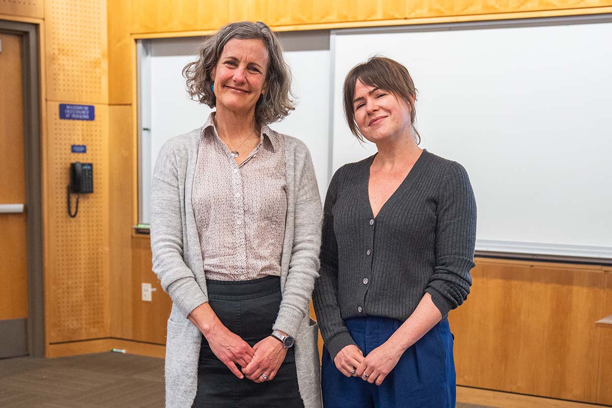 A University of Portland professor and a Public Research Fellow stand in class together