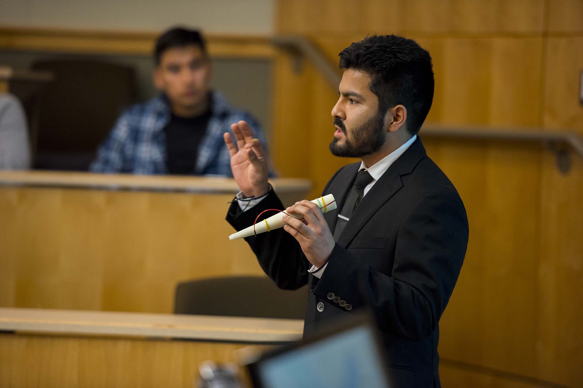 University of Portland business student presenting a product in an entrepreneurship competition.