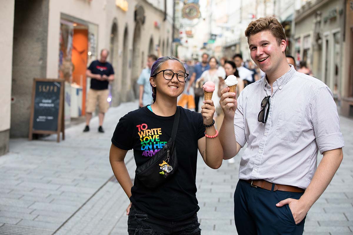 Two University of Portland study abroad students enjoy ice cream while exploring downtown Salzburg, Austria