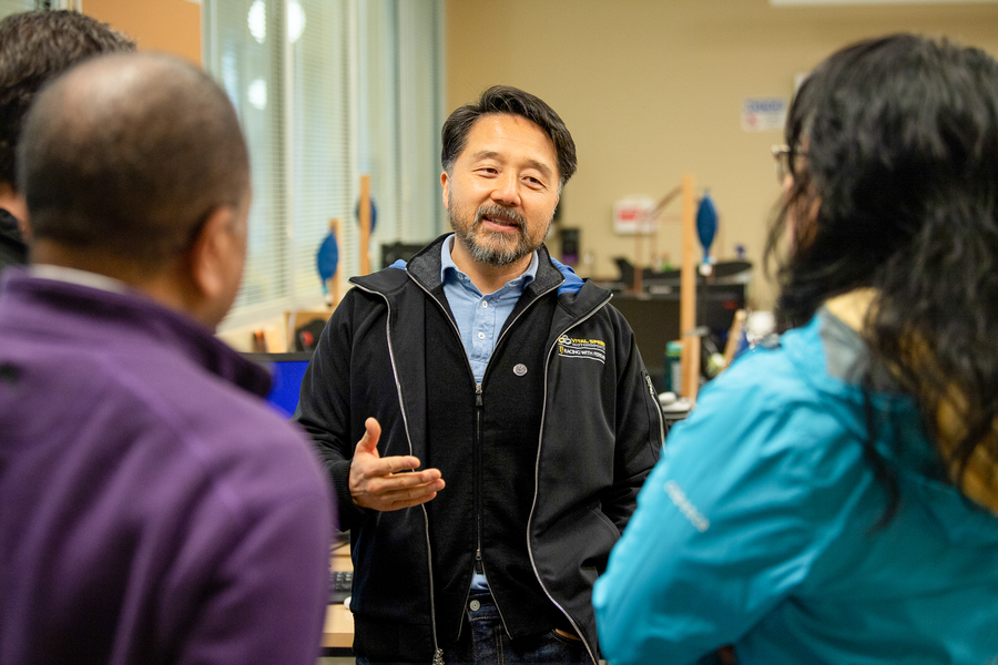 University of Portland professors have a congenial discussion with representatives from student internship partner organizations.