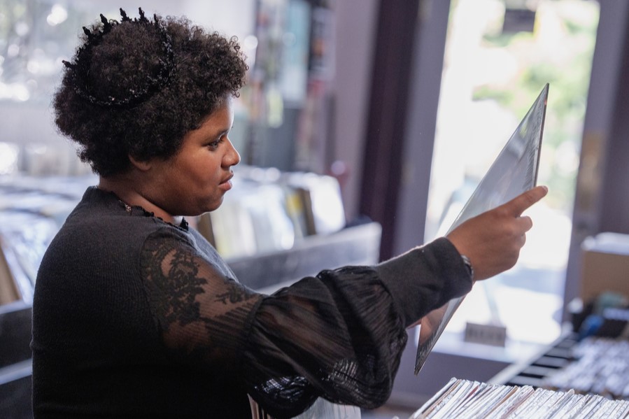 A student looks at a vinyl record in a music shop located in St Johns neighborhood of north Portland.