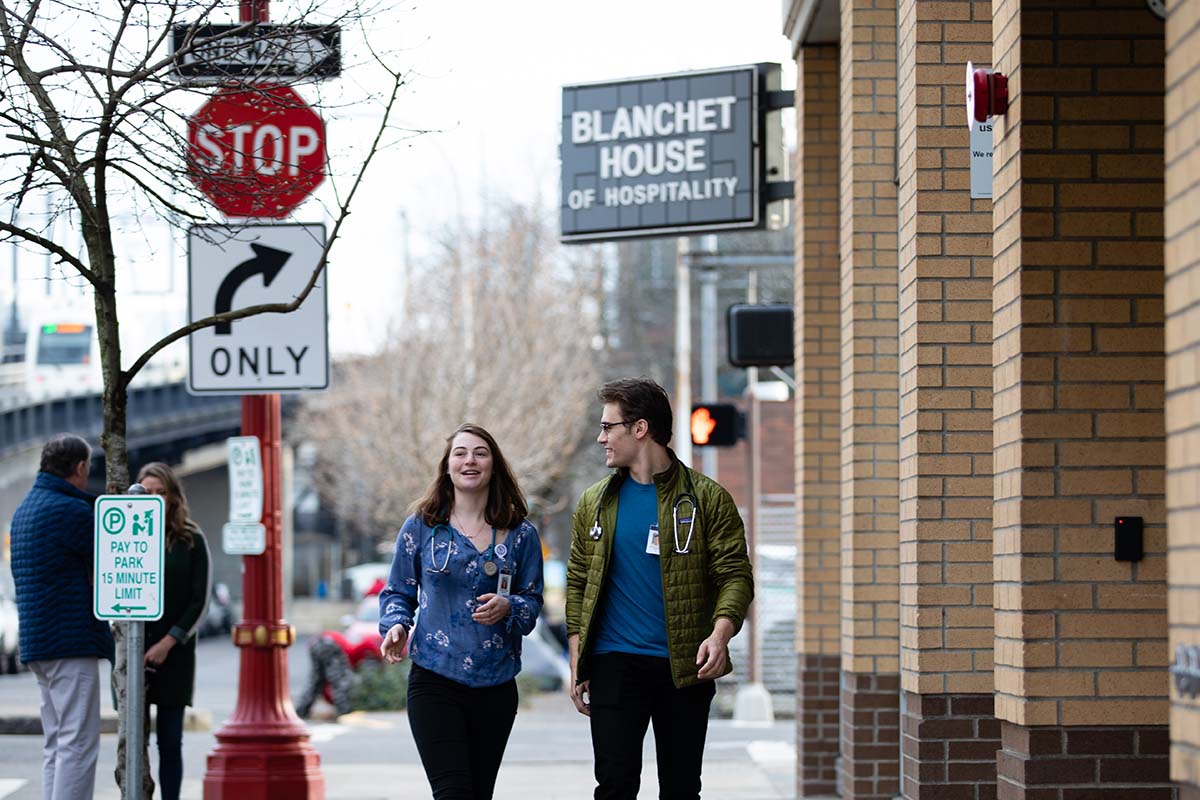 Two University of Portland nursing students leaving the Blanchet House where they were providing medical care to unhoused and at-risk people