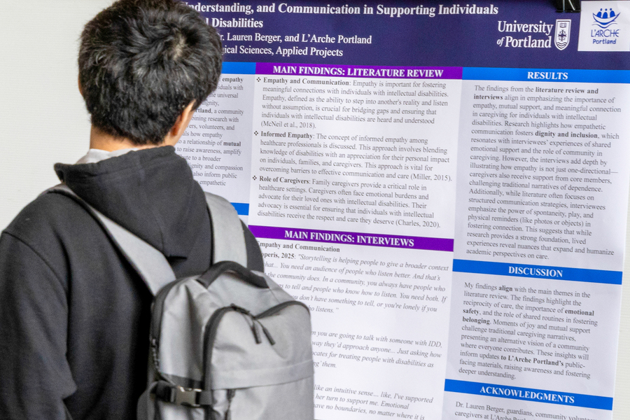 Student browsing research poster