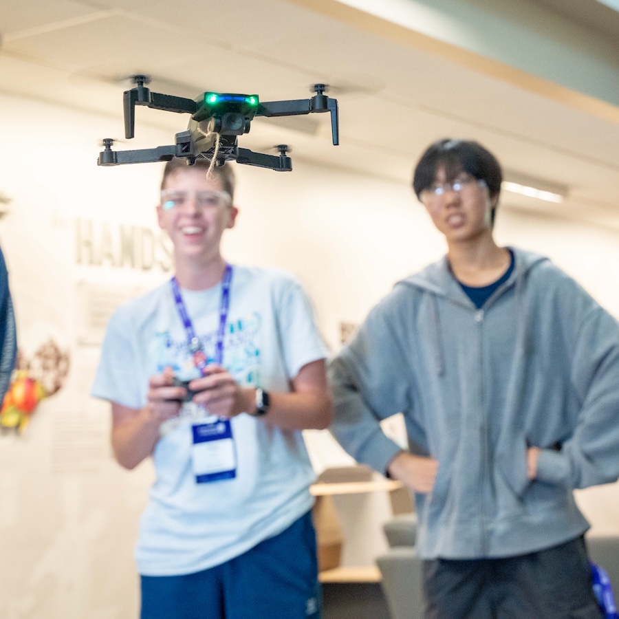 University of Portland engineering students working with a drone in the Shiley-Marcos Center for Design and Innovation