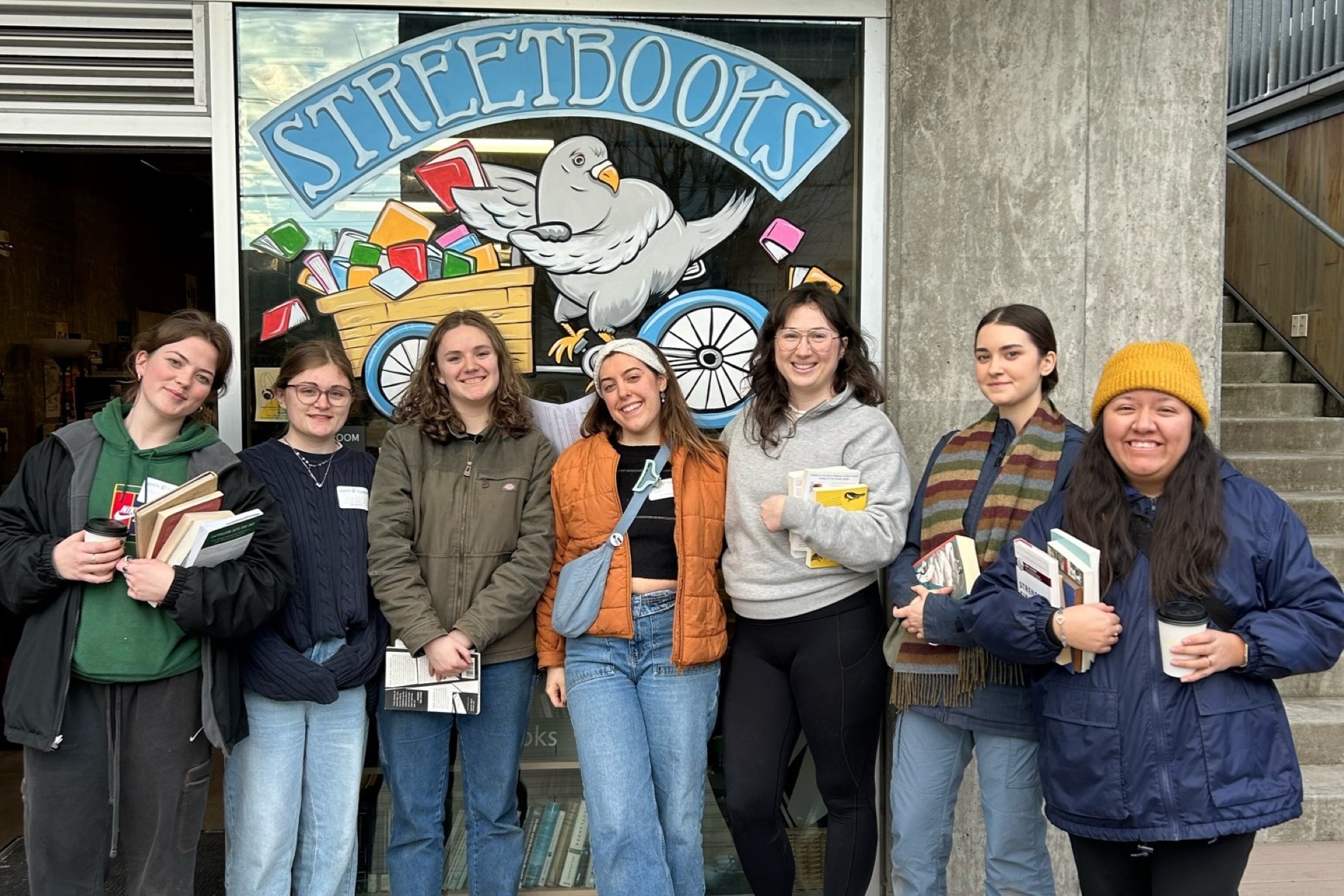 University of Portland students standing outside the Street Books community resource library.