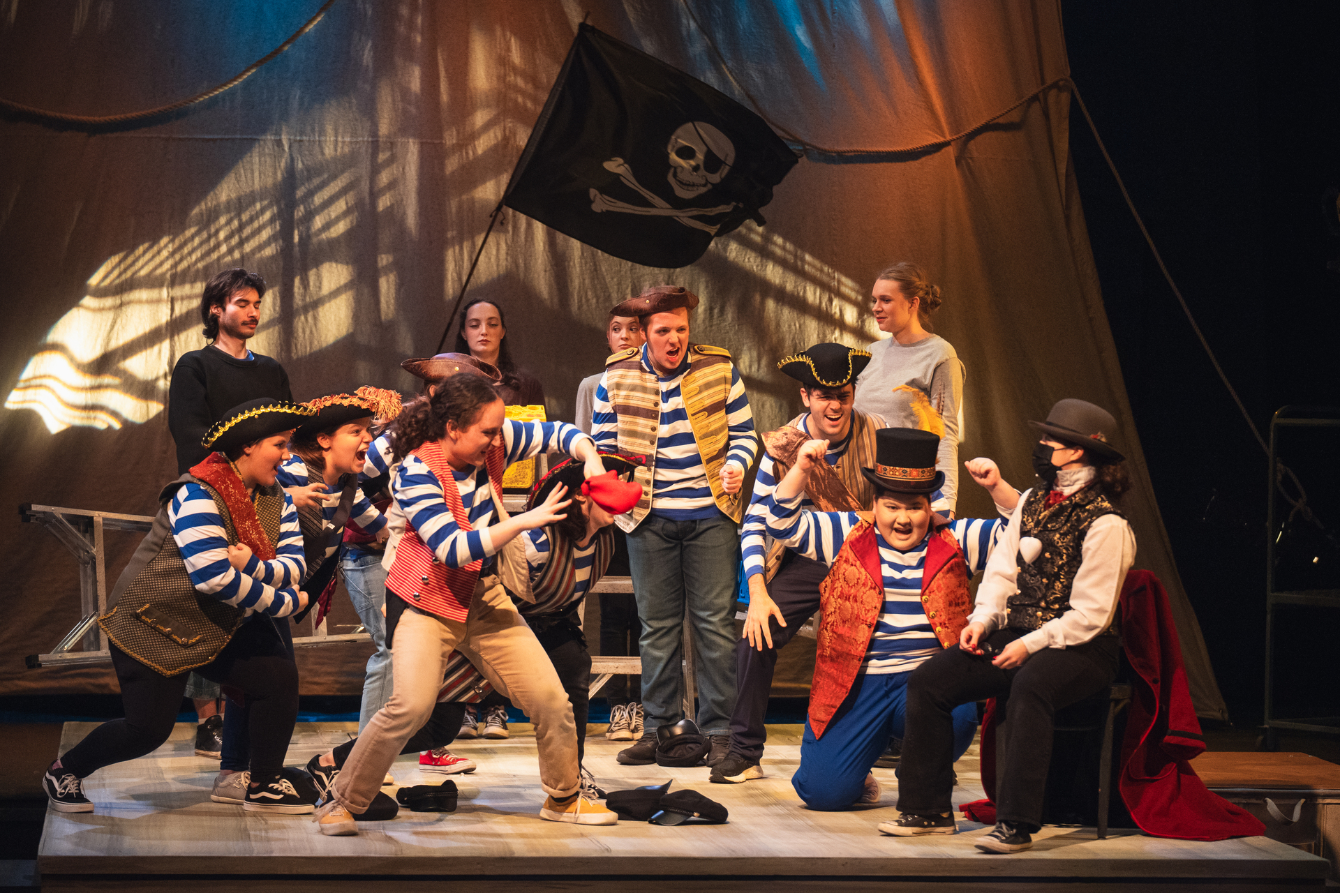 Theater students acting out a scene in the University of Portland production of Peter and The Starcatcher.