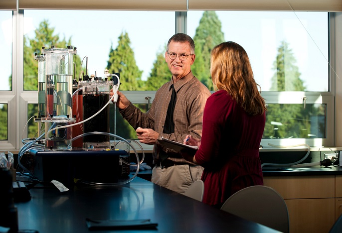 Faculty member and student work together in engineering lab.