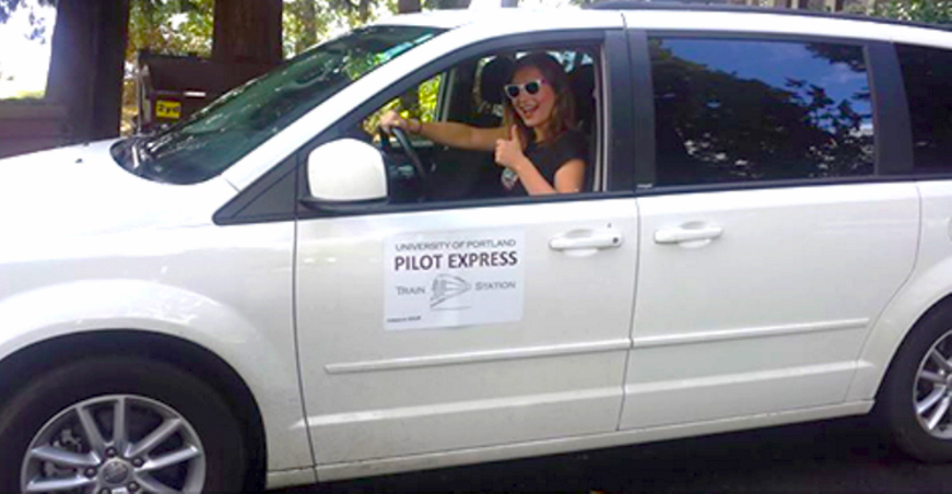 Photo of the Pilot Express car with a driver at the wheel.