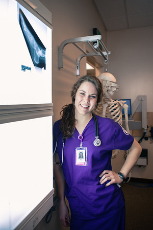 nursing student next to x-ray