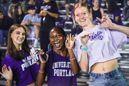 Students cheering at a soccer game