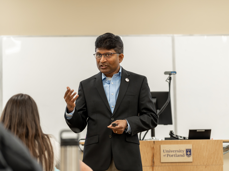 A UP professor speaking during a lecture in a graduate class.