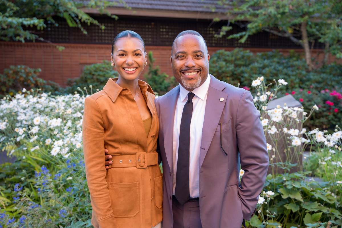 Malika Andrews and UP President Kelly pose outside the Chapel of Christ the Teacher.