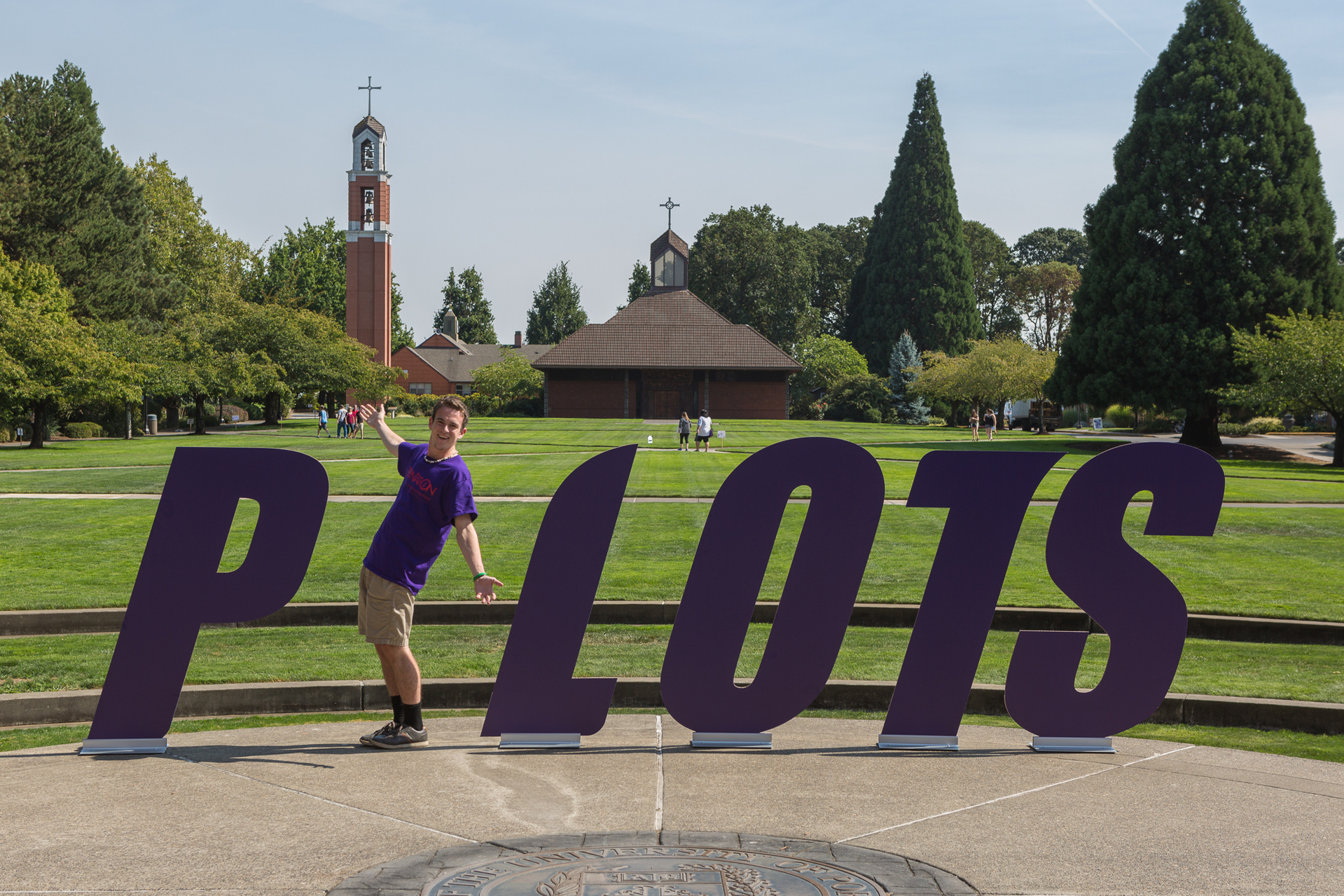 Student standing in place of the I to spell out Pilots in the academic quad