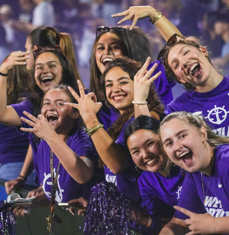 Students cheering at a soccer game
