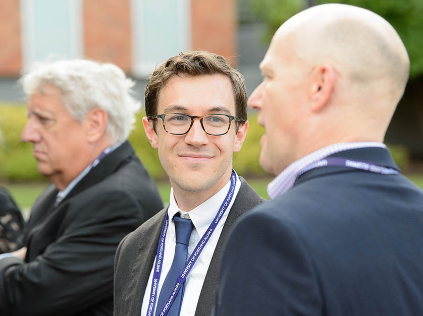 University of Portland alumni chat at an alumni reunion event on campus