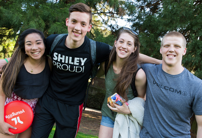 Fours students with a frisbee