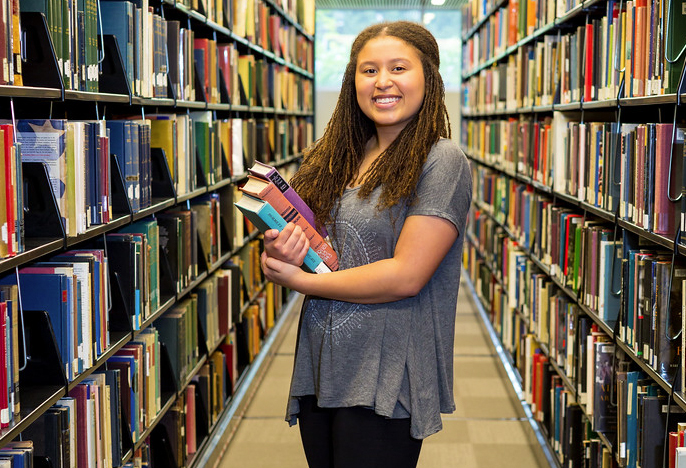 student in library