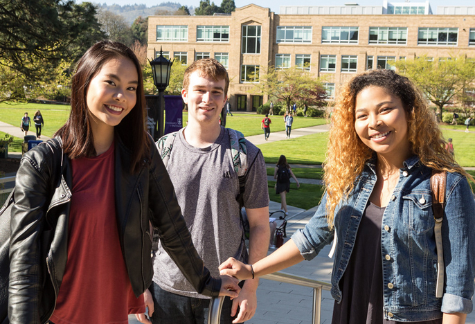 three students outside library