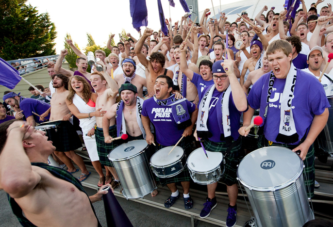 students cheering at soccer game