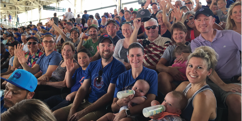 UP alumni sitting at a Chicago Cubs game.