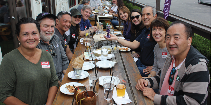 Alumni eating lunch on the patio