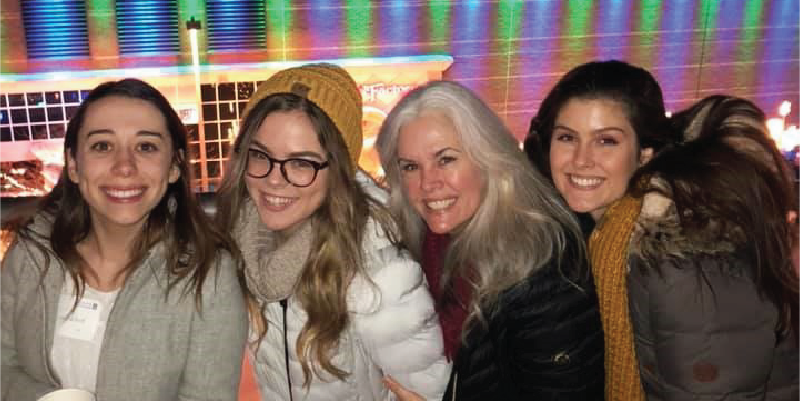 Four alumni bundled up for the snowflake lane parade.