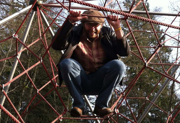 Justin Yeakel in a web-like playground structure