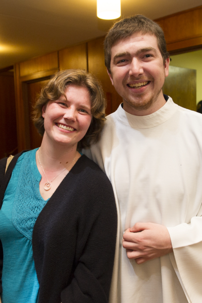 A student lector and server before mass begins