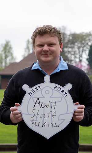 Alex Miller holding First Port sign