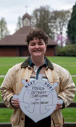 Beth Chvilicek posing with First Port sign