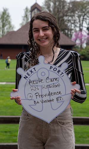 Destiny Kramer holding First Port sign