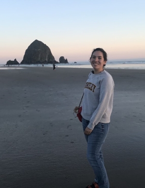 Photo of Hannah Harrison standing on a beach
