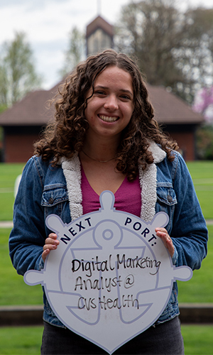 Jordan Villarreal posing with First Port sign