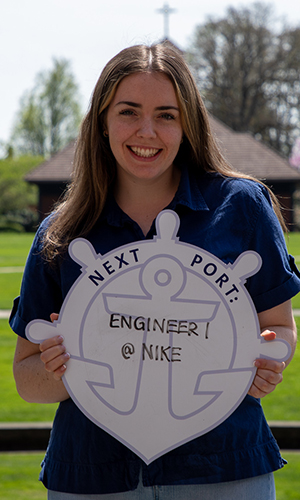 Lauren White holding First Port sign